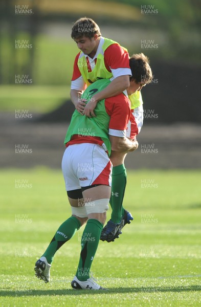 28.10.09 - Wales Rugby Training - Leigh Halfpenny is tackled by Sam Warburton during training. 