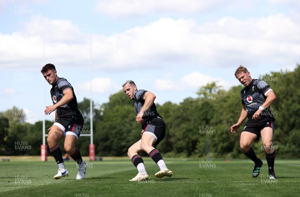 290623 - Wales Rugby Training in preparation for the Rugby World Cup - Joe Roberts, Gareth Davies and Sam Costelow during training