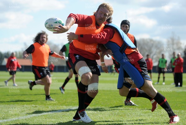 29.09.11 - Wales Rugby Training - Andy Powell is tackled by Ryan Bevington during training. 