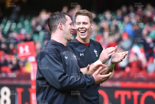 291018 - Wales Rugby Training - Ryan Elias and Liam Williams applaud fans at the end of training