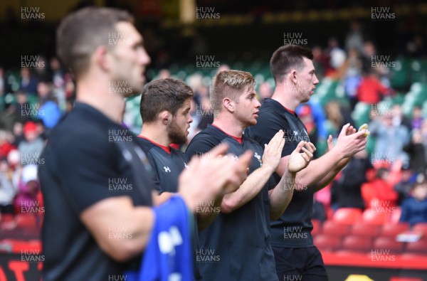 291018 - Wales Rugby Training - George North, Nicky Smith, Aaron Wainwright and Adam Beard applaud fans at the end of training