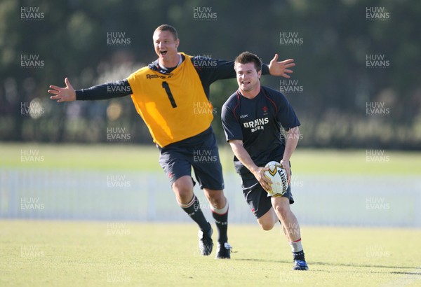 30.05.07  Wales rugby tour to Australia Ceri Sweeney shadowed by Brent Cockbain  in training in Brisbane 
