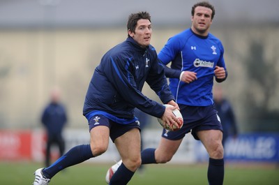 31.01.11 - Wales Rugby Training - James Hook in action during training with Jamie Roberts(R). 