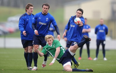 31.01.11 - Wales Rugby Training - Ben John of Wales under 20s is tackled by Jonathan Davies, Jamie Roberts and Stephen Jones during training. 