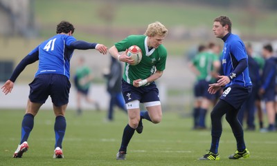 31.01.11 - Wales Rugby Training - Ben John of Wales under 20 takes on Jamie Roberts and Rhys Priestland during training. 