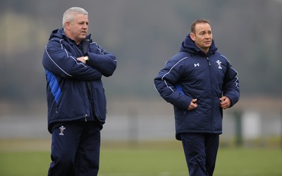 31.01.11 - Wales Rugby Training - Wales under 20 head coach Darren Edwards(r) talks to Wales head coach Warren Gatland during training. 