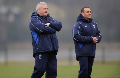 31.01.11 - Wales Rugby Training - Wales under 20 head coach Darren Edwards(r) talks to Wales head coach Warren Gatland during training. 