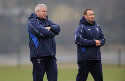 31.01.11 - Wales Rugby Training - Wales under 20 head coach Darren Edwards(r) talks to Wales head coach Warren Gatland during training. 