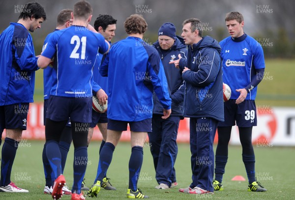 31.01.11 - Wales Rugby Training - Wales assistant coach Rob Howley talks to players during training. 