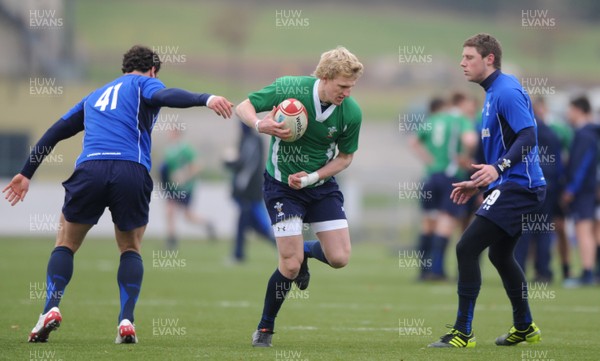 31.01.11 - Wales Rugby Training - Ben John of Wales under 20 takes on Jamie Roberts and Rhys Priestland during training. 