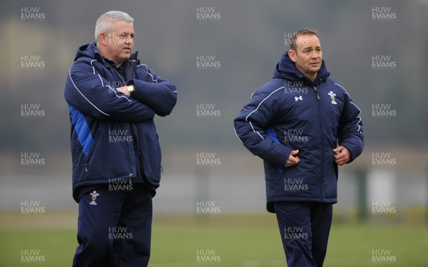31.01.11 - Wales Rugby Training - Wales under 20 head coach Darren Edwards(r) talks to Wales head coach Warren Gatland during training. 