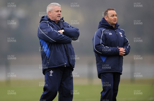 31.01.11 - Wales Rugby Training - Wales under 20 head coach Darren Edwards(r) talks to Wales head coach Warren Gatland during training. 