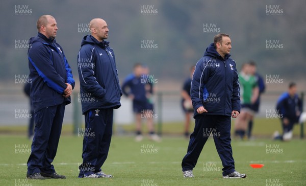 31.01.11 - Wales Rugby Training - Wales under 20 head coach Darren Edwards(r) looks on with his assistants Richard Webster(l) and Rob Appleyard(c) during training. 