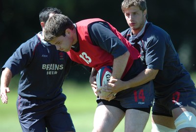 31.07.07 - Wales Rugby Press Conference - Michael Owen is tackled by Robin Sowden-Taylor during training 