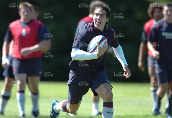 31.07.07 - Wales Rugby Press Conference - James Hook shows off his delight as he gets into space during training 