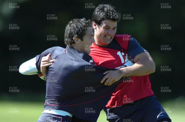 31.07.07 - Wales Rugby Press Conference - James Hook shares a joke with Mike Phillips(R) during training 