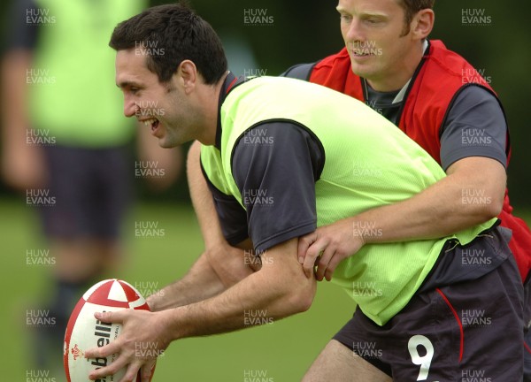 31.08.07 - Wales Rugby Training - Stephen Jones is tackled by Kevin Morgan during training 