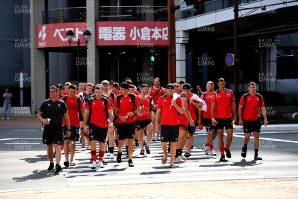 150919 - Wales Rugby Training and Media Interviews - Wales squad walk through the streets of Kitakyushu to training