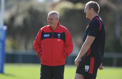 03.09.11 - Wales Rugby Training - Head coach Warren Gatland talks to Bradley Davies during training. 