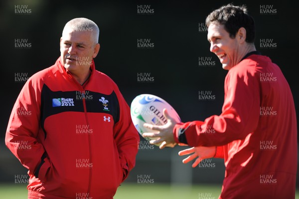 03.09.11 - Wales Rugby Training - Head coach Warren Gatland talks to Stephen Jones during training. 