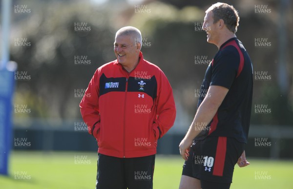 03.09.11 - Wales Rugby Training - Head coach Warren Gatland talks to Bradley Davies during training. 