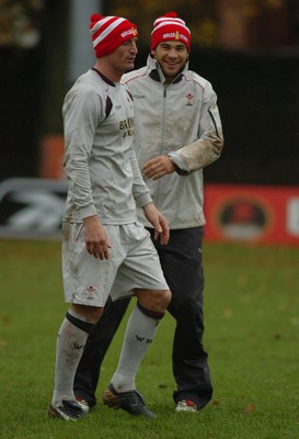 14.11.06 - Wales Rugby Training - Mike Phillips(R) and Gareth Thomas enjoy training in their Children in Need bobble hats 