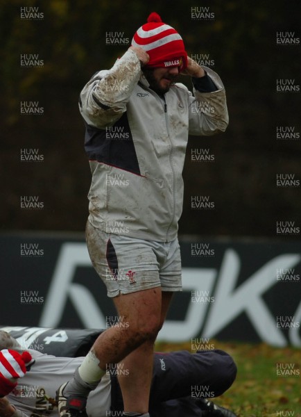 14.11.06 - Wales Rugby Training - Adam Jones tries to adjust his Children in Need bobble hat during training 