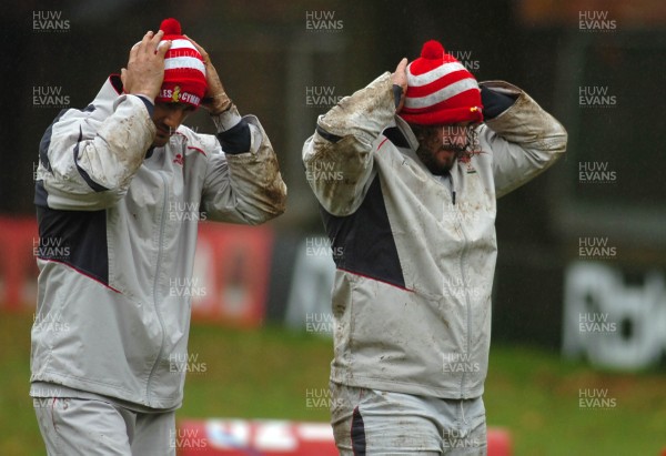 14.11.06 - Wales Rugby Training - Adam Jones and Sonny Parker try to adjust their Children in Need bobble hats during training 