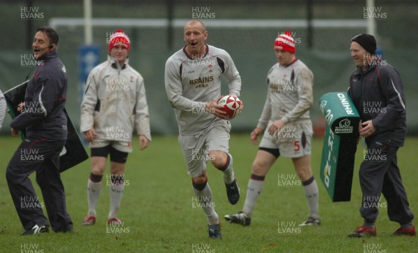 14.11.06 - Wales Rugby Press Conf. - New Wales Captain, Gareth Thomas gets through Nigel Davies(L) and Neil Jenkins(R) 