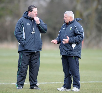 03.03.10 - Wales Rugby Training and Press Conference - Wales under 20 head coach Phil Davies talks to Wales head coach Warren Gatland. 