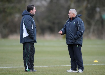 03.03.10 - Wales Rugby Training and Press Conference - Wales under 20 head coach Phil Davies talks to Wales head coach Warren Gatland. 