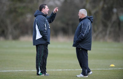 03.03.10 - Wales Rugby Training and Press Conference - Wales under 20 head coach Phil Davies talks to Wales head coach Warren Gatland. 