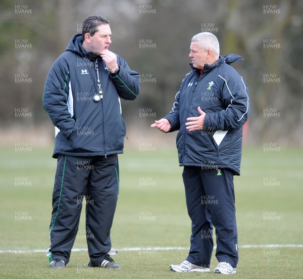 03.03.10 - Wales Rugby Training and Press Conference - Wales under 20 head coach Phil Davies talks to Wales head coach Warren Gatland. 