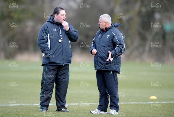 03.03.10 - Wales Rugby Training and Press Conference - Wales under 20 head coach Phil Davies talks to Wales head coach Warren Gatland. 