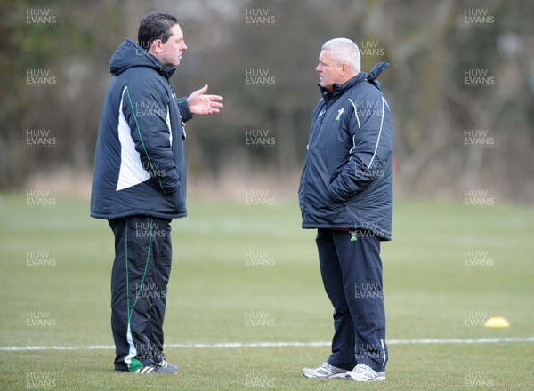 03.03.10 - Wales Rugby Training and Press Conference - Wales under 20 head coach Phil Davies talks to Wales head coach Warren Gatland. 