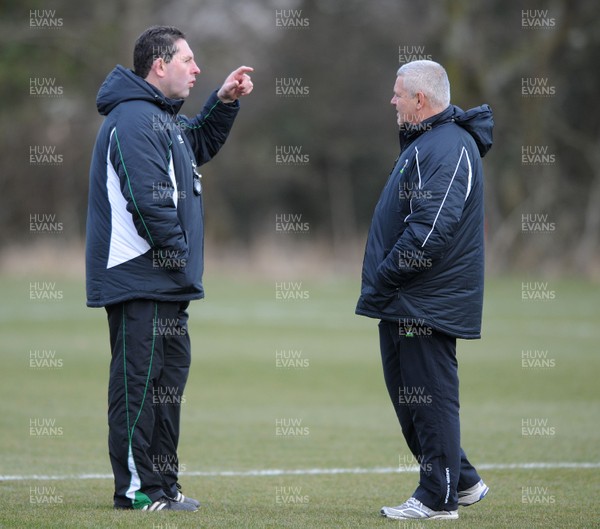 03.03.10 - Wales Rugby Training and Press Conference - Wales under 20 head coach Phil Davies talks to Wales head coach Warren Gatland. 