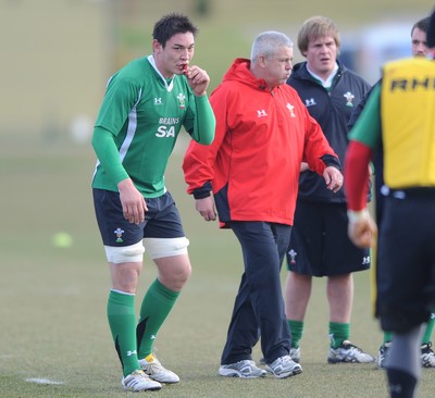 09.03.10 - Wales Rugby Training - Gareth Delve in action during training as Warren Gatland looks on. 