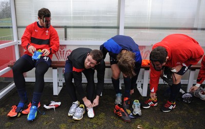 29.11.11 - Wales Rugby Training  Shane Williams puts his boots on as George North, Liam Williams and Ryan Bevington wear masks with his face on after he was named in the Wales team to play Australia, which will be his last game for his country before he retires from international rugby. 