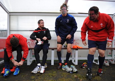 29.11.11 - Wales Rugby Training  Shane Williams puts his boots on as George North, Liam Williams and Ryan Bevington wear masks with his face on after he was named in the Wales team to play Australia, which will be his last game for his country before he retires from international rugby. 