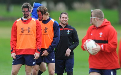 29.11.11 - Wales Rugby Training  Shane Williams looks on as team mates wear masks with his face on after he was named in the Wales team to play Australia, which will be his last game for his country before he retires from international rugby. 