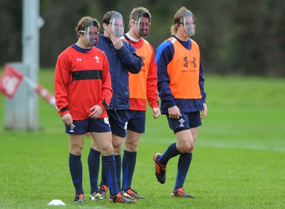 29.11.11 - Wales Rugby Training  Leigh Halfpenny, Lloyd Williams, Dan Biggar and Liam Williams wear masks with Shane Williams face on after he was named in the Wales team to play Australia, which will be his last game for his country before he retires from international rugby. 