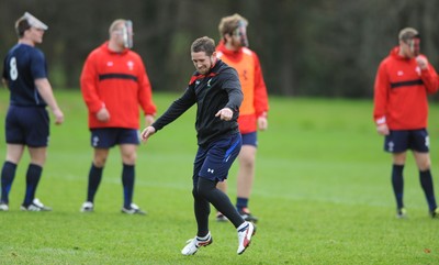 29.11.11 - Wales Rugby Training  Shane Williams looks on as team mates wear masks with his face on after he was named in the Wales team to play Australia, which will be his last game for his country before he retires from international rugby. 