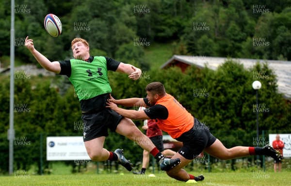 180719 - Wales Rugby World Cup Training Camp in Fiesch, Switzerland - Rhys Carre is tackled by Nicky Smith during training