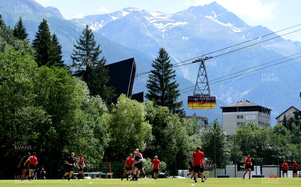 190719 - Wales Rugby World Cup Training Camp in Fiesch, Switzerland - Players train as a cable car passes