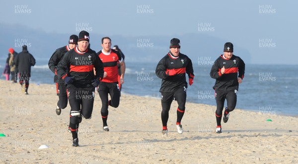 27.01.12 - Wales Rugby Training Camp in Poland - Bradley Davies, Ian Evans, Lou Reed, Huw Bennett and Ken Owens during fitness training on the beach. 