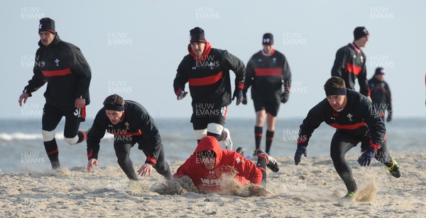 27.01.12 - Wales Rugby Training Camp in Poland - Lloyd Williams, Justin Tipuric and Rhys Webb during fitness training on the beach. 