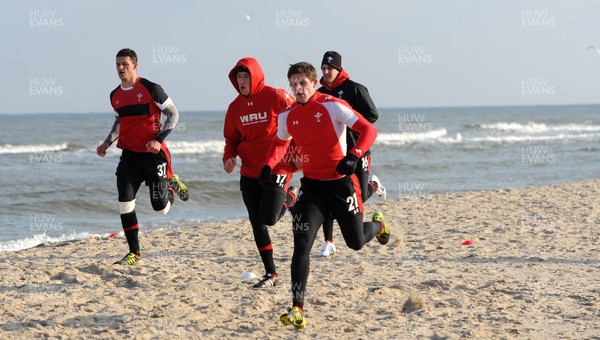 27.01.12 - Wales Rugby Training Camp in Poland - Aaron Shingler, Justin Tipuric Lloyd Williams and Ryan Jones during fitness training on the beach. 