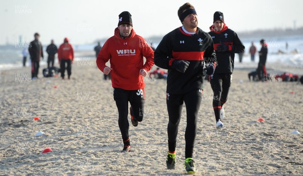 27.01.12 - Wales Rugby Training Camp in Poland - Stephen Jones, Rhys Webb and Sam Warburton during fitness training on the beach. 