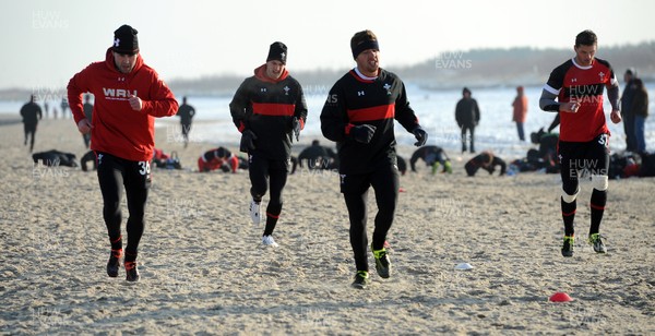 27.01.12 - Wales Rugby Training Camp in Poland - Stephen Jones, Sam Warburton, Rhys Webb and Aaron Shingler during fitness training on the beach. 