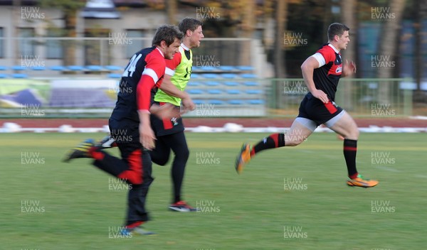 311012 - Wales Rugby Training Camp in Poland -Dan Biggar, Rhys Priestland and Scott Williams during training